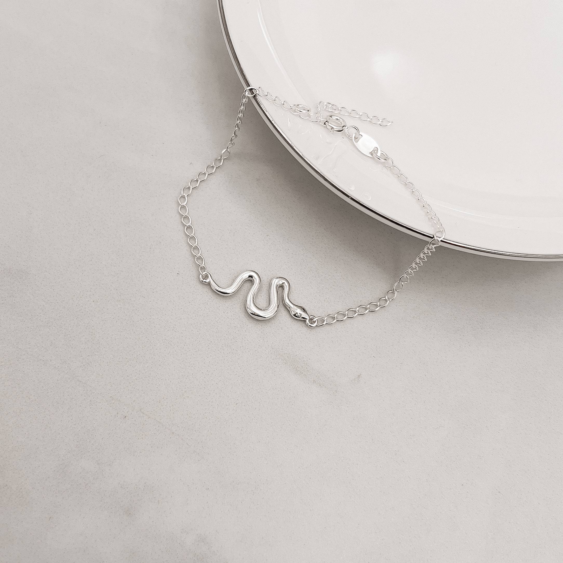 Pulseira entremeio cobra lisa com zircônia 22mm