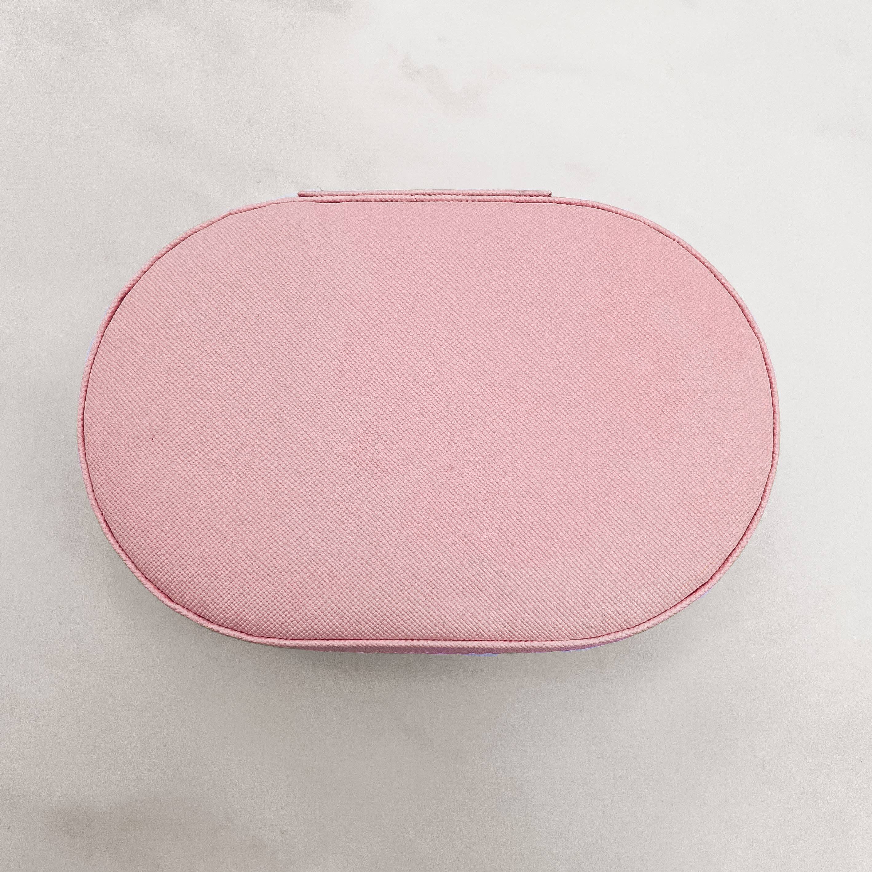 Porta-joias oval rosa 14x9x4cm zíper dourado