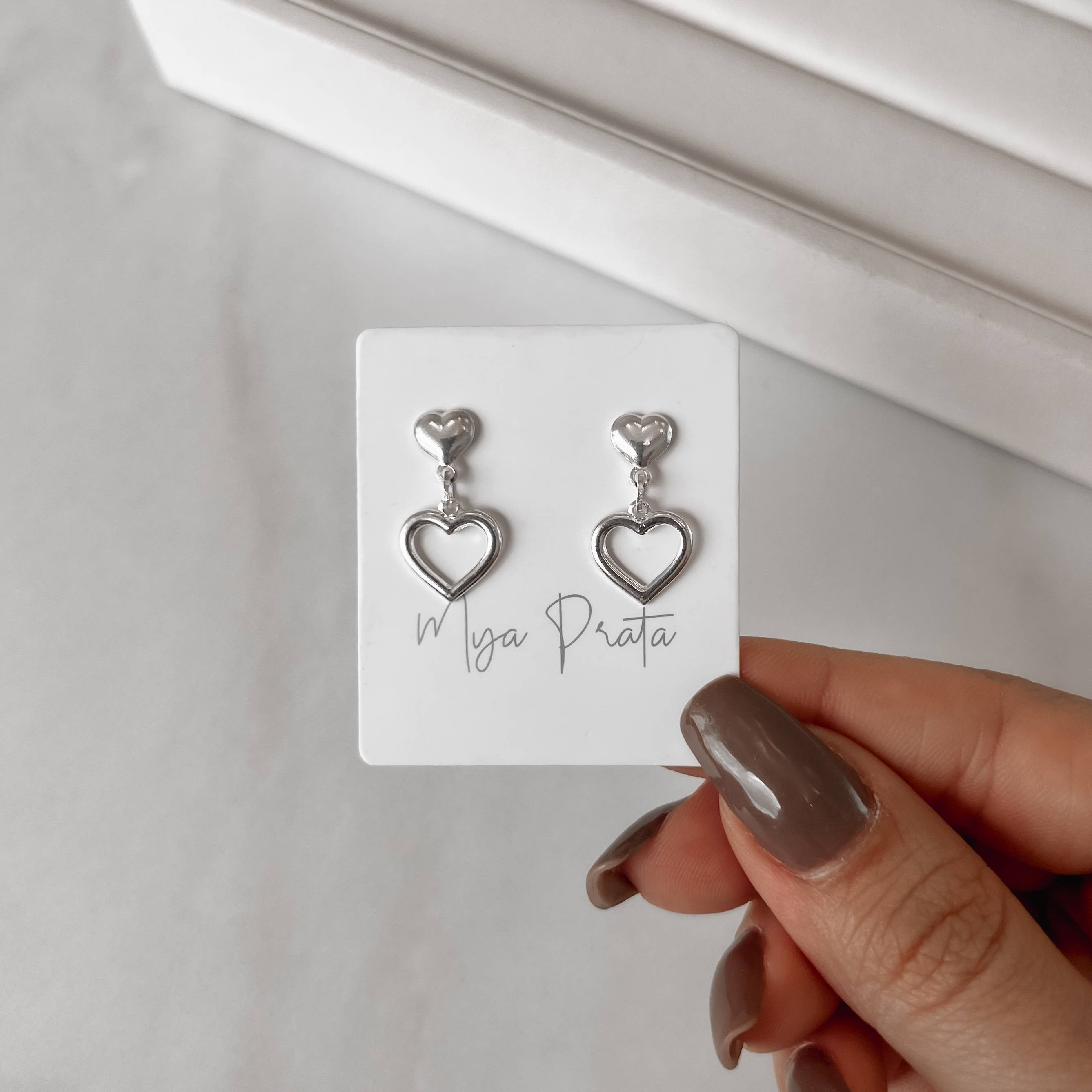 Imagem Brinco coração com pingente coração vazado 11mm