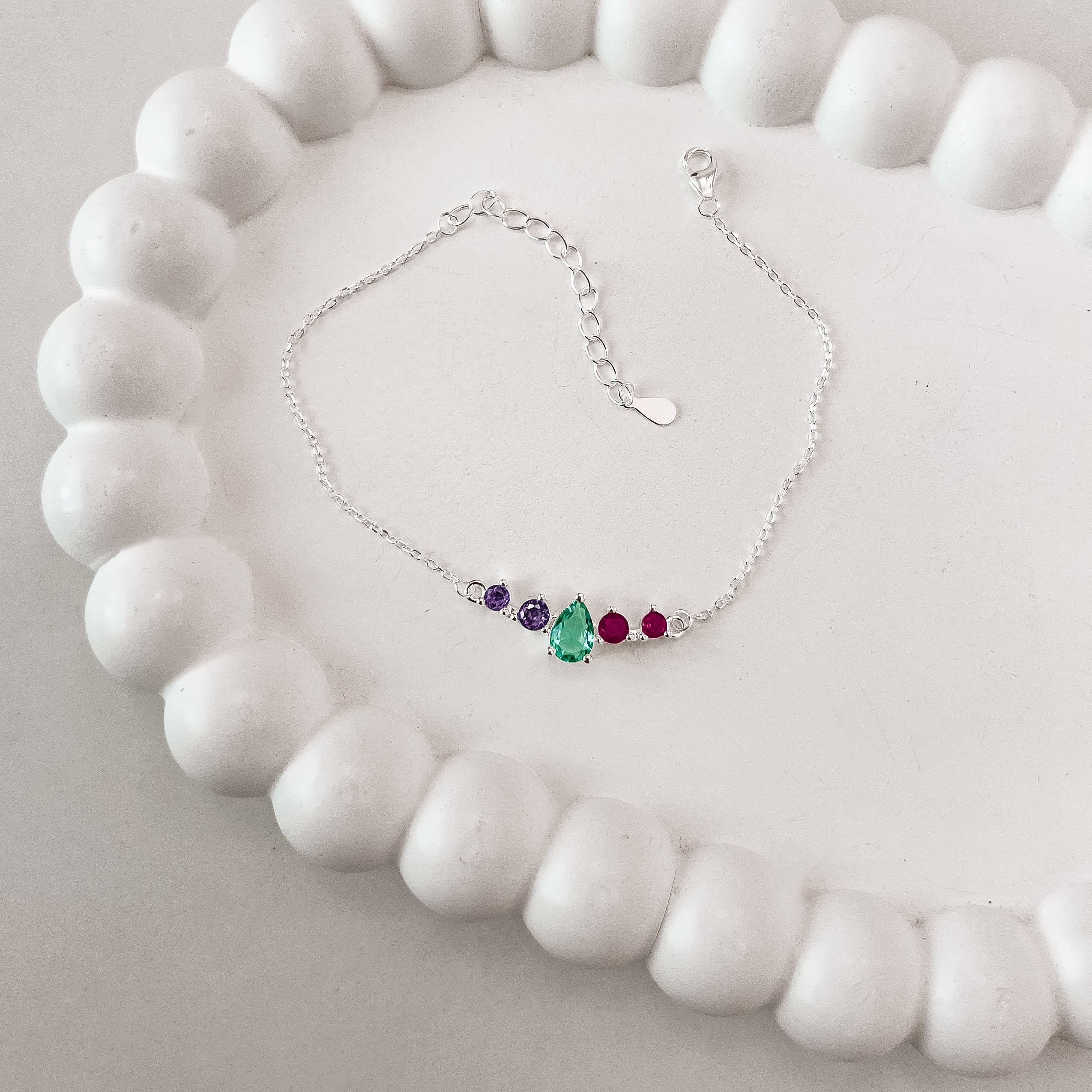 Pulseira entremeio zircônias gota acqua e redondas lilás e pink