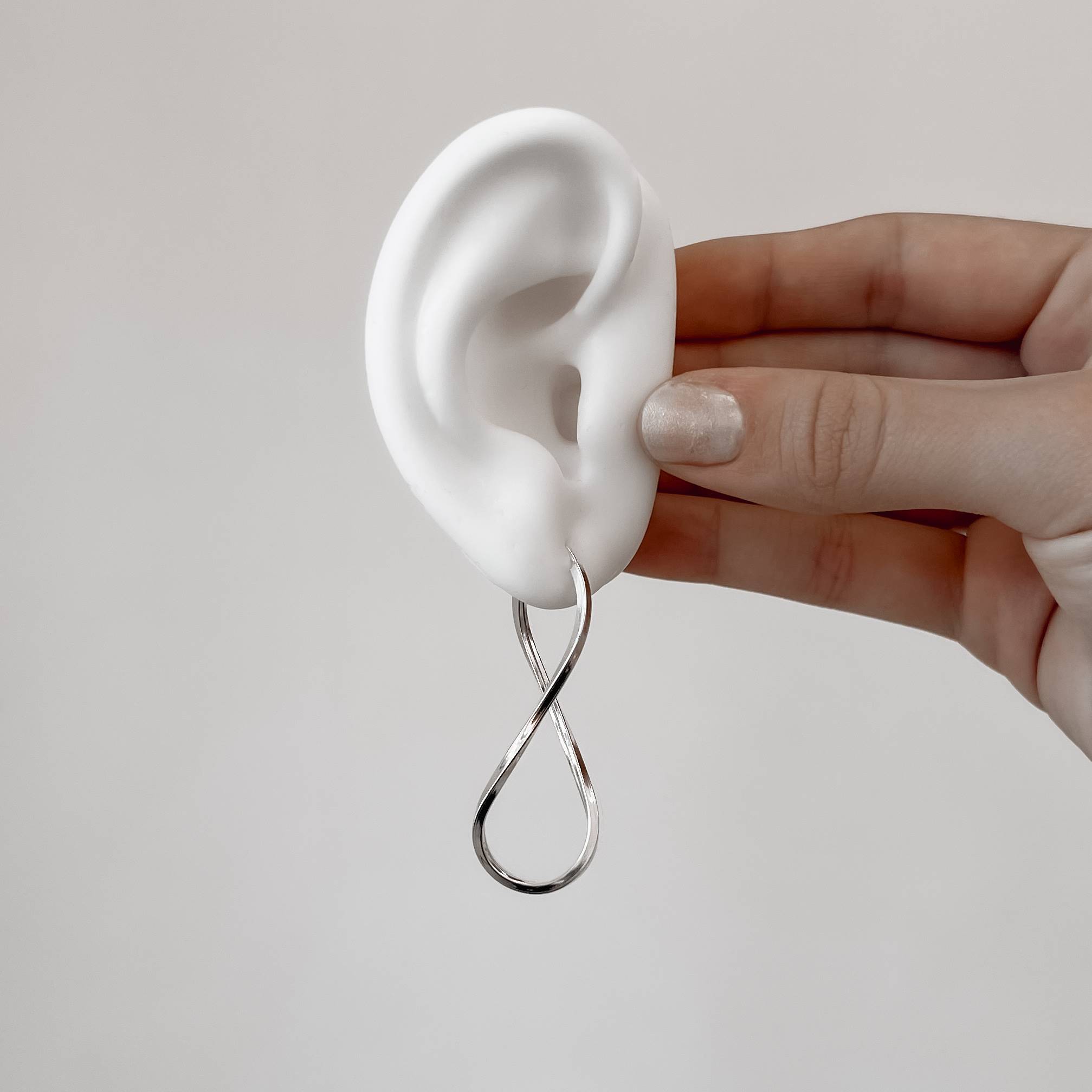 Imagem Secundária Argola infinito 50mm fio quadrado