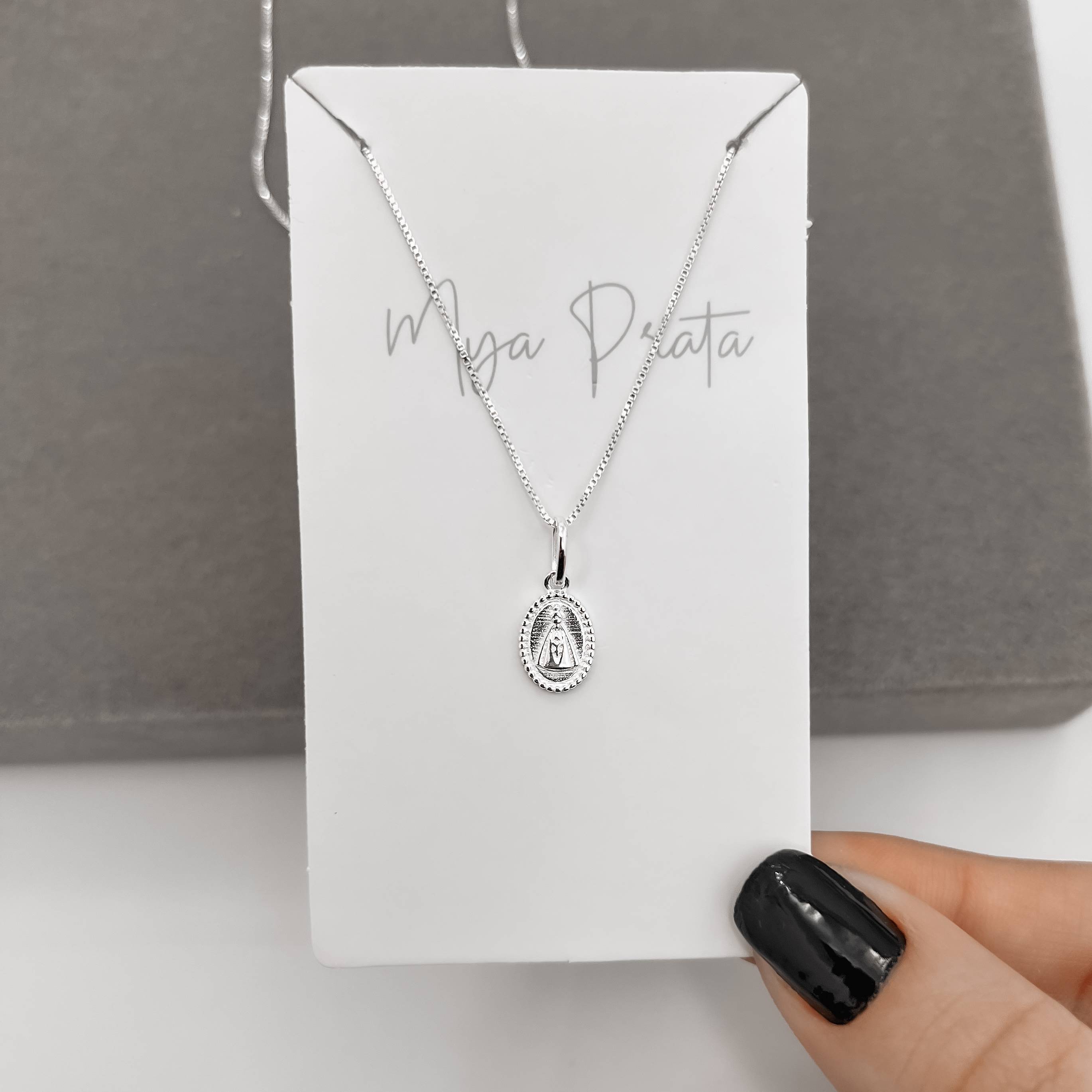 Imagem Secundária Colar pingente medalha oval Nsa. Sra. Aparecida 10mm 45cm