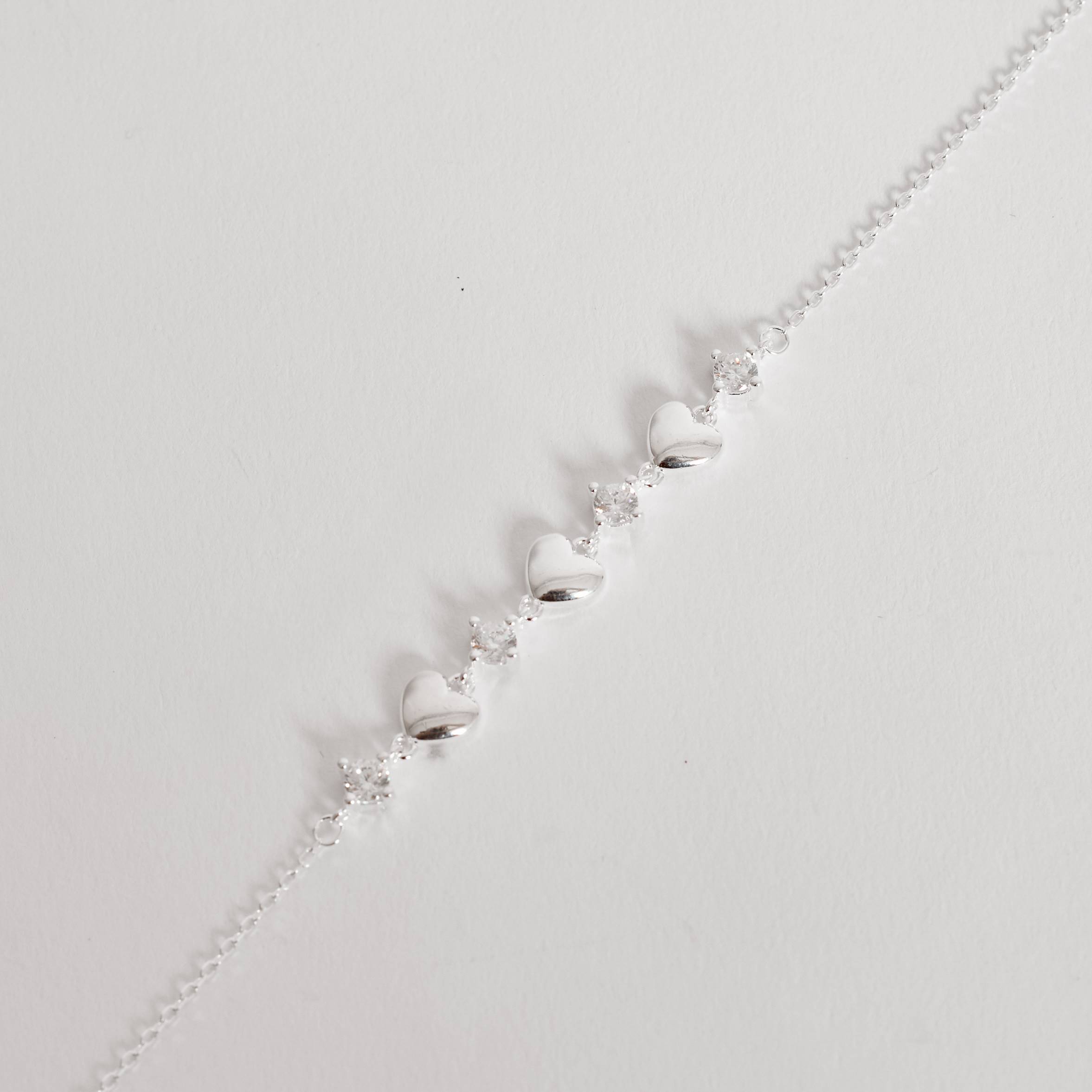 Pulseira entremeios zircônias e corações 16+4cm