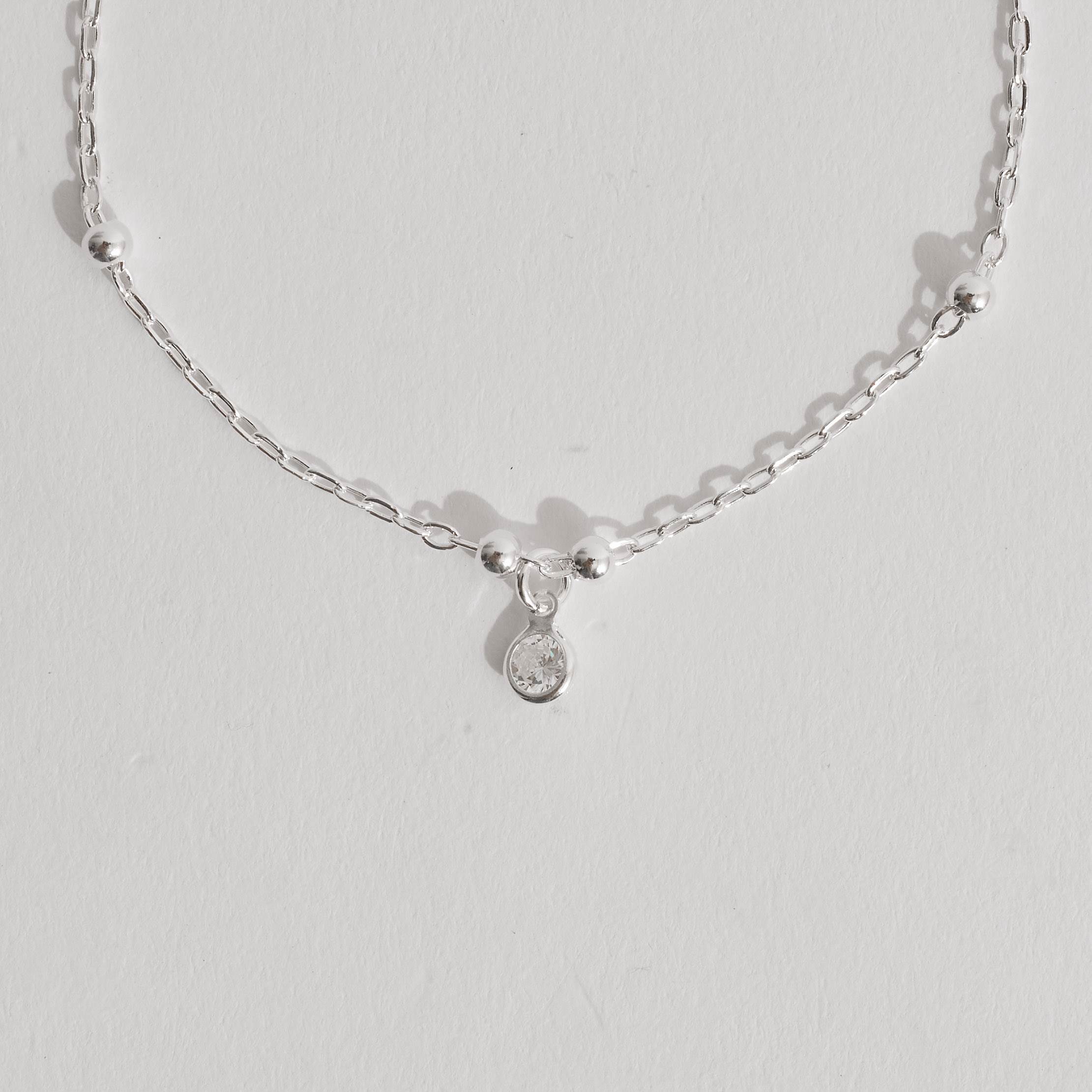 Imagem Pulseira infantil entremeio bolas 3mm e pingente zircônia 4mm 15cm