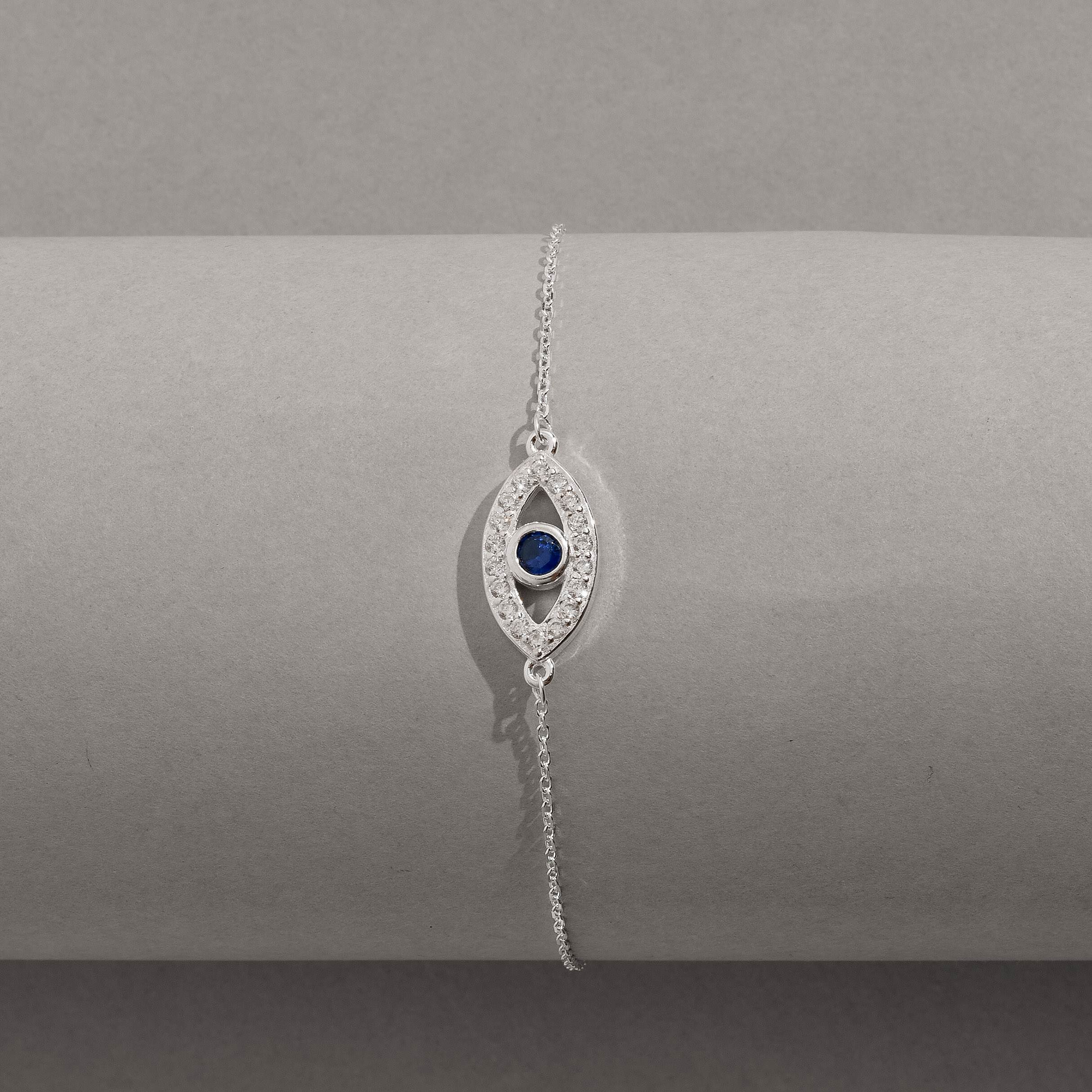 Imagem Secundária Pulseira entremeio olho grego cravejado detalhe zircônia azul 16mm