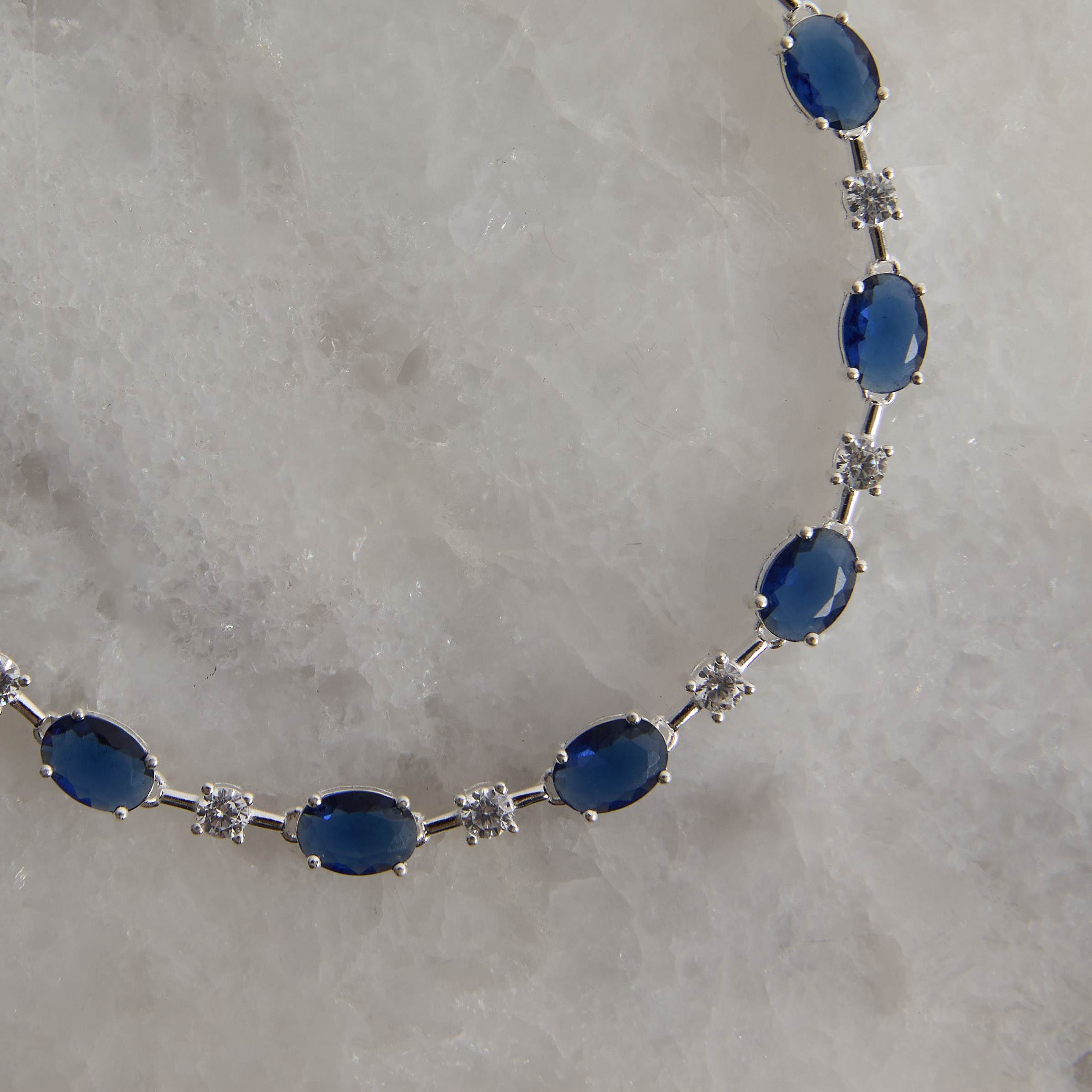 Pulseira Riviera fio faca zircônias ovais safira e redondas cristal 18,5cm fecho gaveta